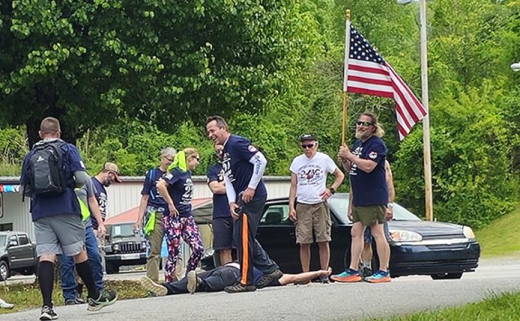 Nicole Wright/Staff Correspondent The 22-Humpers take a final break at the Hiwassee Street Boat Ramp on Saturday at Warriors Veteran Outreach’s 10th annual event to raise awareness for veterans’ suicides.