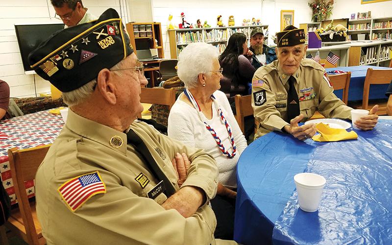 J.C. and Mary McCoy chat with Oscar Valdez (right) during the veterans breakfast provided by Martins Creek School on Tuesday morning.