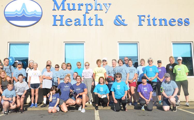 Staff from Murphy Health & Fitness, along with citizens from the community, pose before a 5K run to benefit foster children in May 2019. Photo by Penny Ray