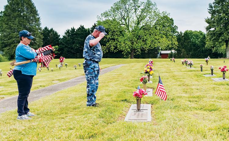 J.D. Baker salutes the fallen. Photo by Sam Jokich