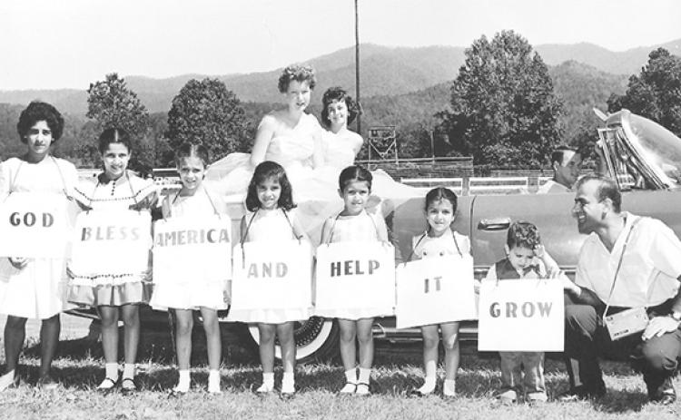 Joseph (Joe) El-Khouri’s entry in the Fourth of July parade in the summer of 1962 expressed how extremely proud he was to be a U.S. citizen. This photo includes five of the El-Khouri children and two of their cousins from Copperhill, Tenn.