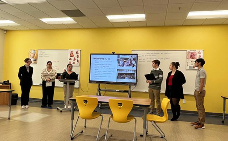 Tri-County Early College student leaders make a presentation to a regional meeting of early college principals and representatives of the N.C. Department of Public Instruction. The students shared information and personal experiences about what makes them successful at the Peachtree high school.